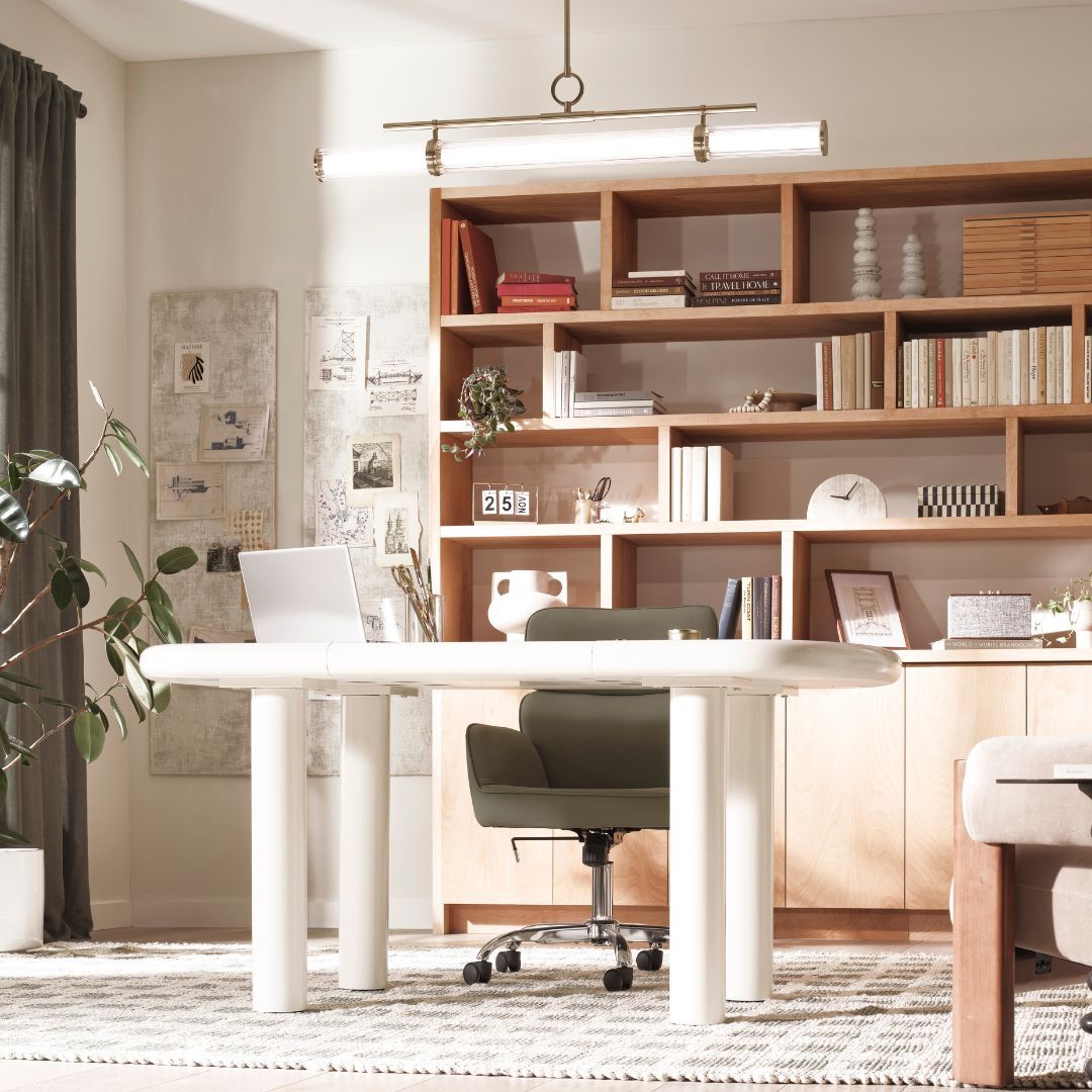 home office with shelving accent wall and multiple lighting sources home office with shelving accent wall and multiple lighting sources